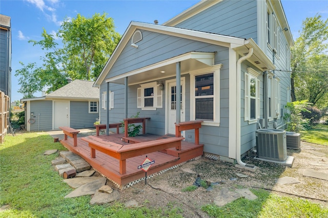 344 Harvard St, Houston, TX 77007 - back of property featuring central air condition unit, a wooden deck, and a yard