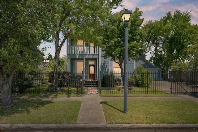 344 Harvard St, Houston, TX 77007 - view of front of house featuring a balcony, a gate, driveway, and a garage