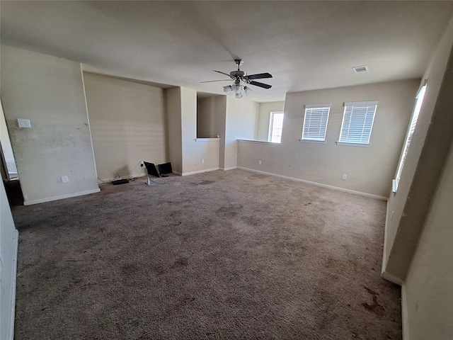 2419 Fort Baldy Trl, Humble, TX 77396 - unfurnished living room featuring ceiling fan, carpet, and baseboards