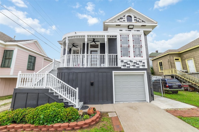 1611 19th St, Galveston, TX 77550 - victorian home with stairs, ceiling fan, concrete driveway, and covered porch