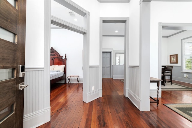1611 19th St, Galveston, TX 77550 - hall featuring dark wood finished floors, ornamental molding, and a wainscoted wall