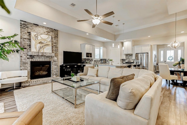 321 Twin Timbers Ln, Kemah, TX 77565 - living room with light wood finished floors, a ceiling fan, plenty of natural light, and recessed lighting