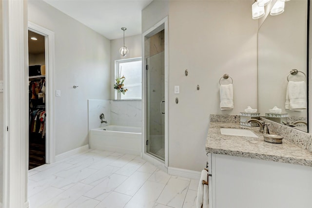 321 Twin Timbers Ln, Kemah, TX 77565 - full bath featuring baseboards, a bath, vanity, a shower stall, and marble finish floors