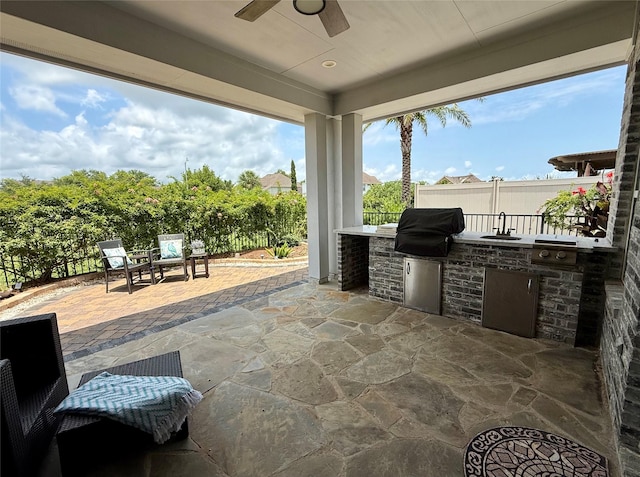 321 Twin Timbers Ln, Kemah, TX 77565 - view of patio / terrace with exterior kitchen, a ceiling fan, and a sink