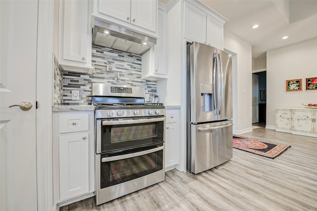 321 Twin Timbers Ln, Kemah, TX 77565 - kitchen featuring stainless steel appliances, under cabinet range hood, backsplash, white cabinets, and light wood-type flooring