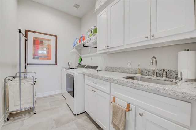 321 Twin Timbers Ln, Kemah, TX 77565 - laundry room with independent washer and dryer, cabinet space, and baseboards