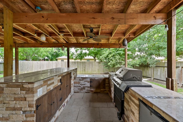 12305 Ridgecrest Dr, Willis, TX 77318 - fenced backyard featuring area for grilling and ceiling fan