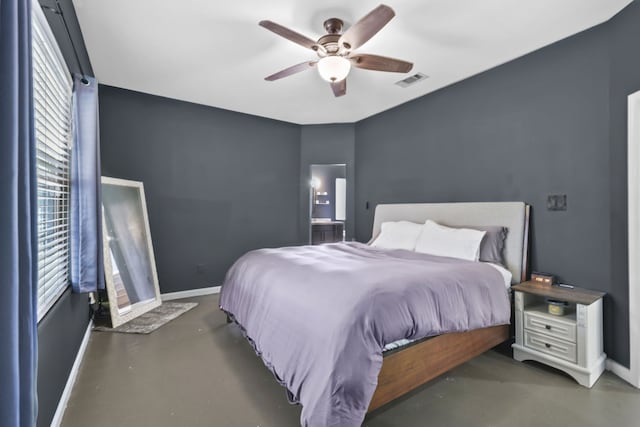 12305 Ridgecrest Dr, Willis, TX 77318 - bedroom featuring concrete flooring, baseboards, multiple windows, and ceiling fan