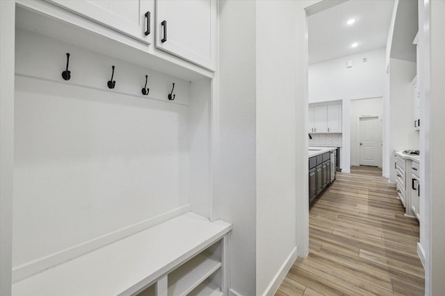 23910 Birchwood Lake Ln, Katy, TX 77493 - mudroom with light wood-style flooring, baseboards, and recessed lighting