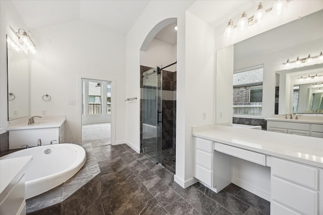 23910 Birchwood Lake Ln, Katy, TX 77493 - bathroom with plenty of natural light, a stall shower, two vanities, a bath, and lofted ceiling