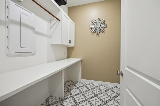 23910 Birchwood Lake Ln, Katy, TX 77493 - washroom featuring electric panel, baseboards, and light flooring