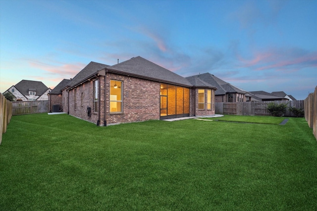 23910 Birchwood Lake Ln, Katy, TX 77493 - back of property with brick siding, roof with shingles, and central AC