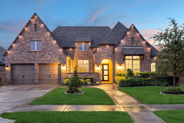 23910 Birchwood Lake Ln, Katy, TX 77493 - view of front facade featuring concrete driveway, brick siding, a lawn, and a garage