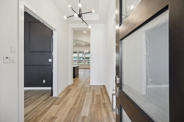23910 Birchwood Lake Ln, Katy, TX 77493 - entrance foyer featuring a chandelier, light wood-type flooring, and baseboards
