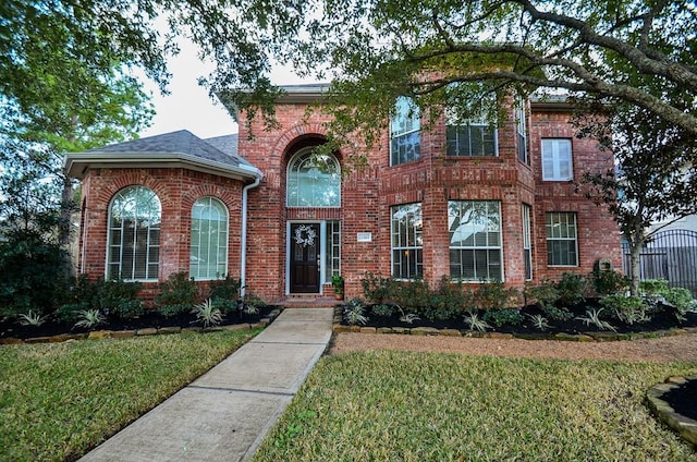 22503 Rippling Shore Ct, Katy, TX 77494 - traditional-style home featuring a front lawn and brick siding
