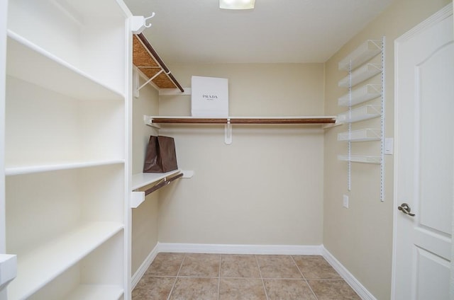 22503 Rippling Shore Ct, Katy, TX 77494 - walk in closet with tile patterned flooring