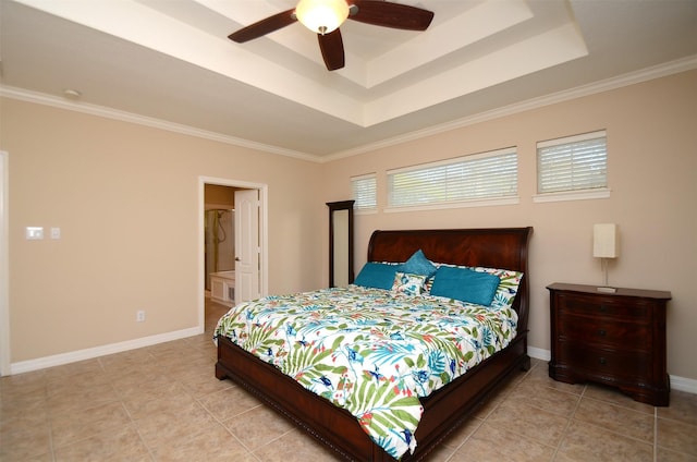 22503 Rippling Shore Ct, Katy, TX 77494 - bedroom with a tray ceiling, ornamental molding, light tile patterned flooring, ceiling fan, and connected bathroom