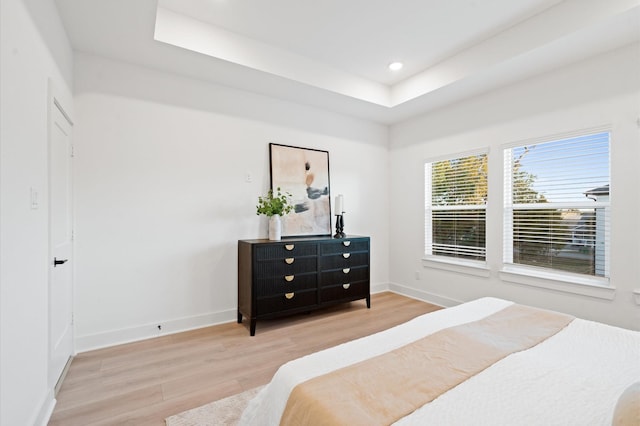 3848 Seabrook St, Houston, TX 77021 - bedroom with wood finished floors, a tray ceiling, baseboards, and recessed lighting