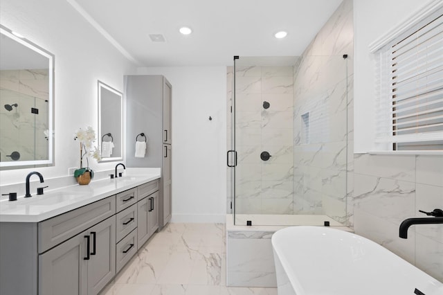 3848 Seabrook St, Houston, TX 77021 - full bathroom featuring marble finish flooring, a freestanding tub, a marble finish shower, double vanity, and recessed lighting
