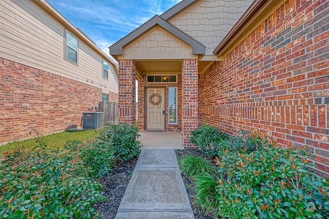 24927 Scarlatti Cantata Dr, Katy, TX 77493 - view of exterior entry featuring central air condition unit and brick siding