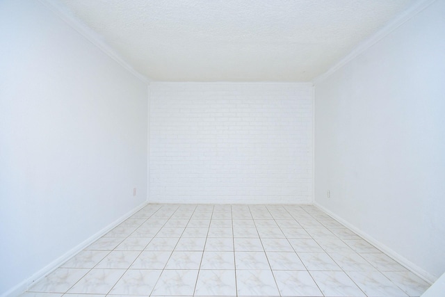 12251 Sharpview Dr, Houston, TX 77072 - unfurnished room featuring crown molding, a textured ceiling, and brick wall