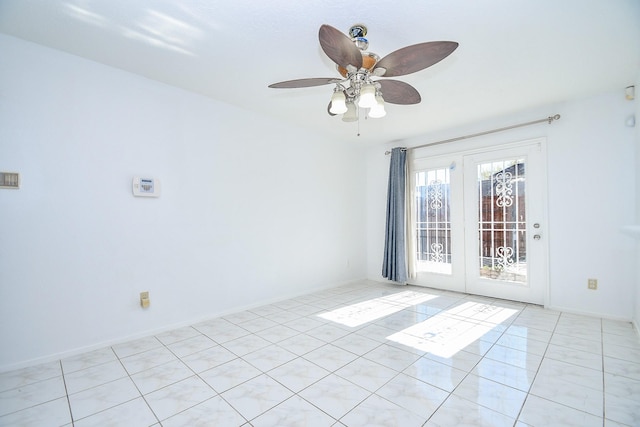 12251 Sharpview Dr, Houston, TX 77072 - empty room featuring ceiling fan, french doors, and light tile patterned floors