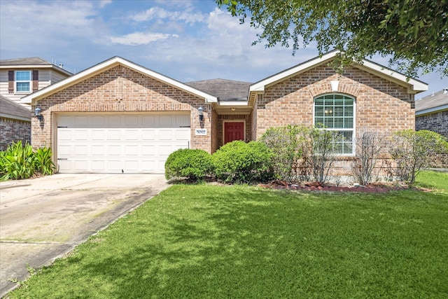 5002 Manor Stone Ln, Rosenberg, TX 77469 - view of front of house featuring brick siding, an attached garage, and a front lawn