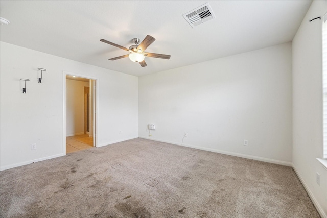 5002 Manor Stone Ln, Rosenberg, TX 77469 - unfurnished room featuring ceiling fan, carpet floors, baseboards, and a smoke detector