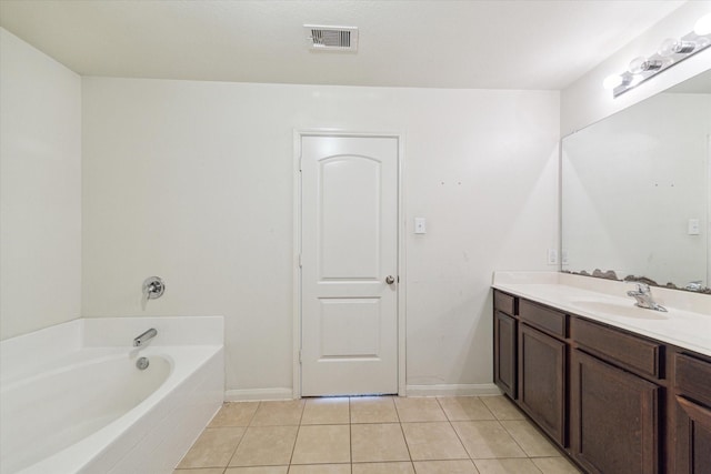 5002 Manor Stone Ln, Rosenberg, TX 77469 - full bathroom with tile patterned floors, vanity, a bath, and baseboards