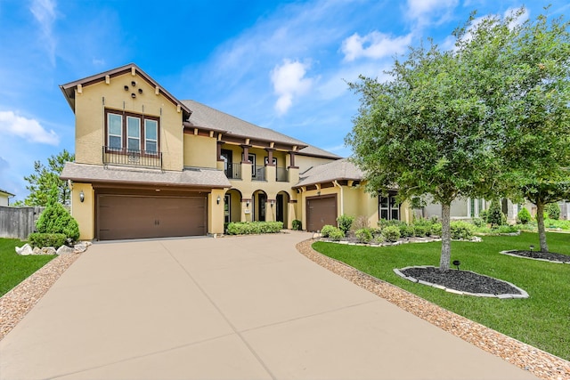 27415 Ashford Sky Ln, Katy, TX 77494 - mediterranean / spanish home featuring stucco siding, a balcony, and concrete driveway