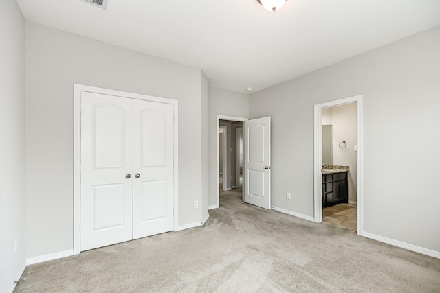27415 Ashford Sky Ln, Katy, TX 77494 - unfurnished bedroom featuring carpet flooring, a closet, and ensuite bath