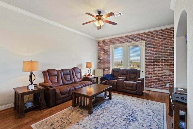 620 Cathedral Sq, Beaumont, TX 77701 - living room with ceiling fan, wood finished floors, ornamental molding, brick wall, and baseboards