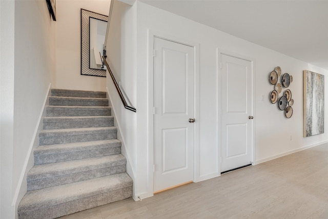 3025 Wild Dunes Dr, Katy, TX 77493 - stairs with wood finished floors and baseboards