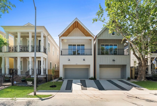 322 Aurora St, Houston, TX 77008 - view of front of property featuring a balcony, an attached garage, board and batten siding, driveway, and a porch