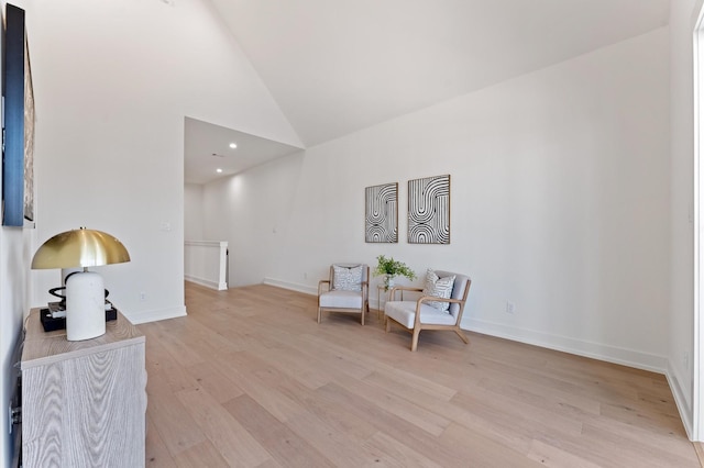322 Aurora St, Houston, TX 77008 - sitting room featuring wood finished floors, an upstairs landing, baseboards, and high vaulted ceiling