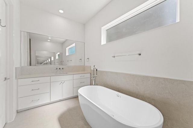 322 Aurora St, Houston, TX 77008 - bathroom with a freestanding tub, vanity, and recessed lighting