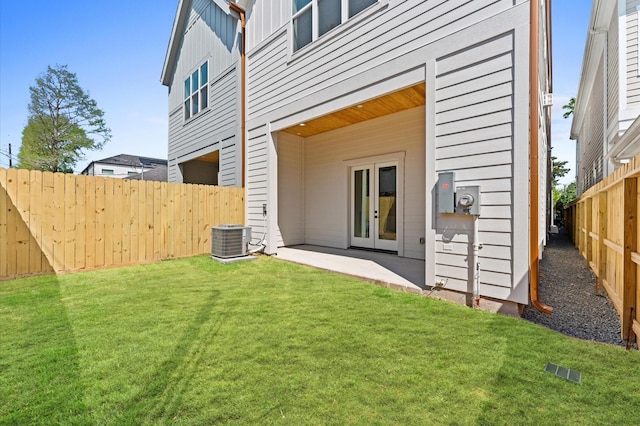 322 Aurora St, Houston, TX 77008 - rear view of property featuring cooling unit, board and batten siding, and french doors