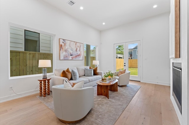 322 Aurora St, Houston, TX 77008 - living room featuring light wood-style flooring, recessed lighting, and baseboards