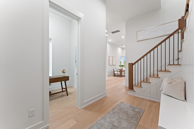 322 Aurora St, Houston, TX 77008 - entrance foyer featuring light wood-style flooring, stairs, baseboards, and recessed lighting