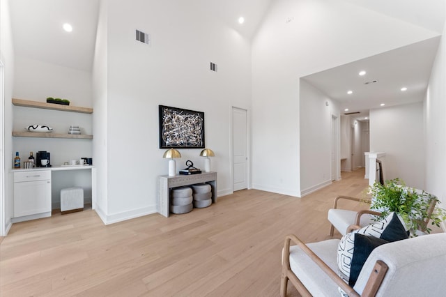 322 Aurora St, Houston, TX 77008 - living area featuring light wood-style floors, a high ceiling, recessed lighting, and baseboards