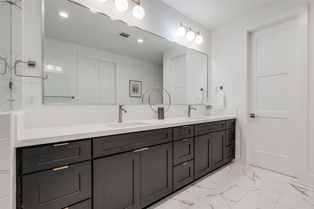 2015 Hopkins St, Houston, TX 77006 - full bath featuring double vanity, marble finish flooring, and recessed lighting