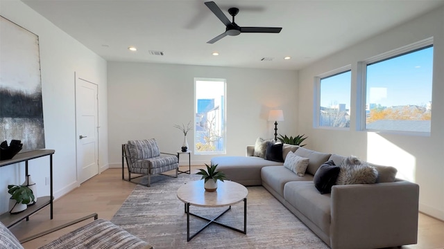 2015 Hopkins St, Houston, TX 77006 - living room with light wood-style floors, recessed lighting, a ceiling fan, and baseboards