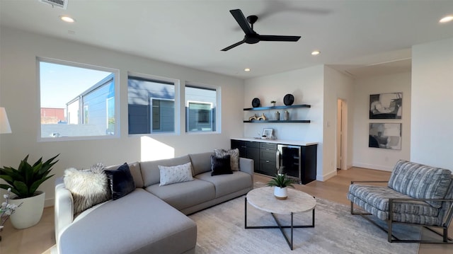 2015 Hopkins St, Houston, TX 77006 - living area with beverage cooler, bar with sink, light wood-style flooring, ceiling fan, and recessed lighting
