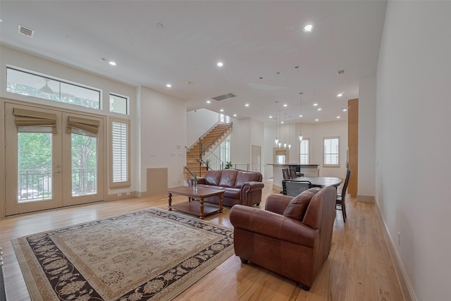 2034 Colquitt St Unit A, Houston, TX 77098 - living area with stairway, light wood-style floors, baseboards, recessed lighting, and french doors