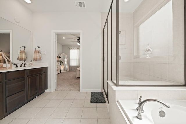 358 Cavil Barrier Ln, La Porte, TX 77571 - full bath with a garden tub, vanity, a stall shower, tile patterned floors, and baseboards