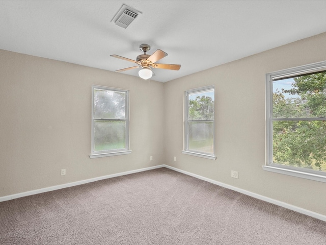 3422 N Elm Rd, Santa Fe, TX 77517 - carpeted empty room with plenty of natural light and ceiling fan