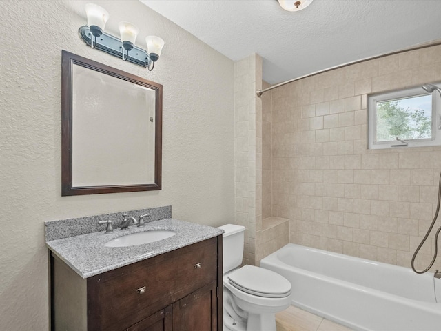 3422 N Elm Rd, Santa Fe, TX 77517 - bathroom featuring a textured wall, toilet, vanity, washtub / shower combination, and a textured ceiling