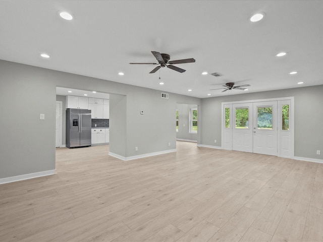 3422 N Elm Rd, Santa Fe, TX 77517 - unfurnished living room featuring recessed lighting, a ceiling fan, plenty of natural light, baseboards, and light wood-type flooring