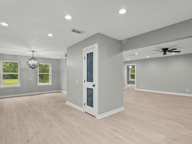 3422 N Elm Rd, Santa Fe, TX 77517 - spare room featuring light wood-style floors, recessed lighting, baseboards, a chandelier, and ceiling fan