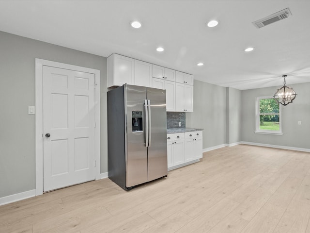 3422 N Elm Rd, Santa Fe, TX 77517 - kitchen featuring stainless steel refrigerator with ice dispenser, white cabinets, baseboards, and recessed lighting